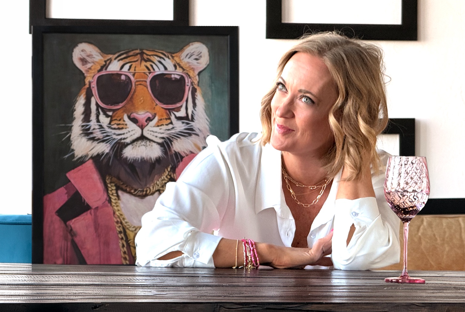 Dalaina Ealy in a creative studio setting wearing bright pink trousers